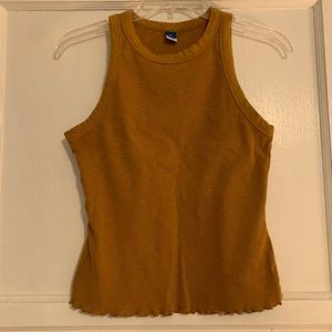 Used but in good condition women medium top.  Mustard color.